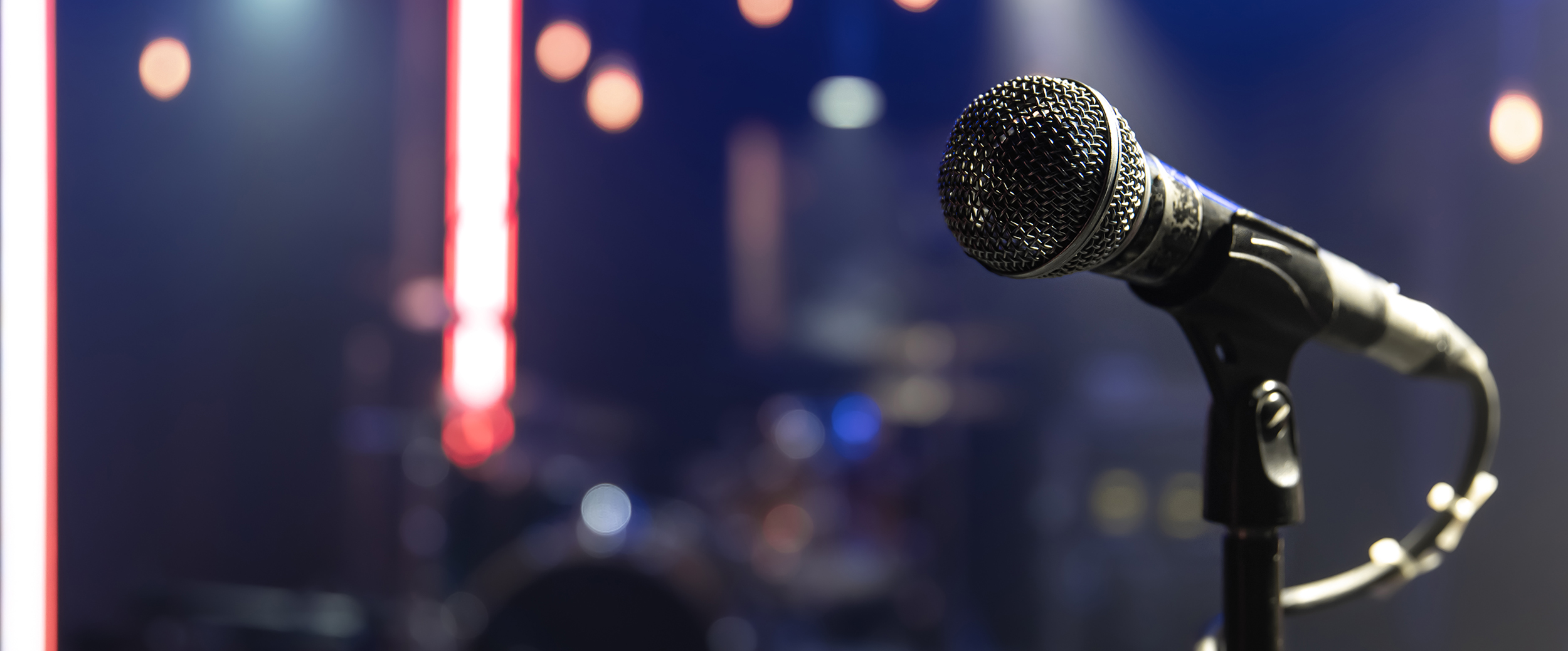 Close up microphone on blurred background with bokeh.
