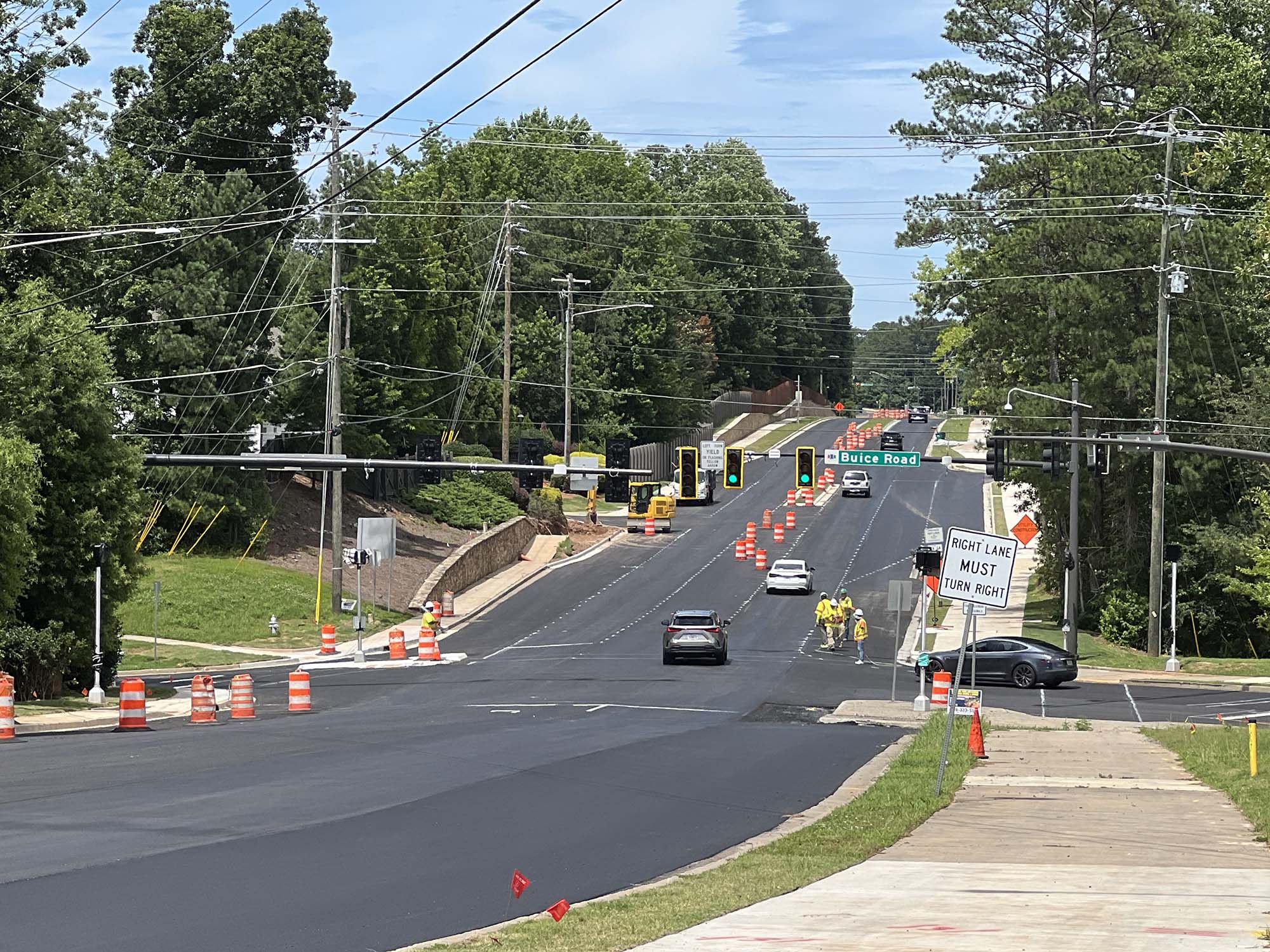 A photo of Jones Bridge Road and its newly paved surface near the Buice Road intersection